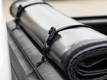 Storage straps and buckles secure the cover in an open position