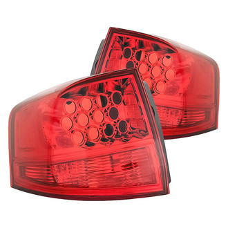 Replacement - Driver and Passenger Side Outer Tail Light Lens and Housing Set (Standard Line)